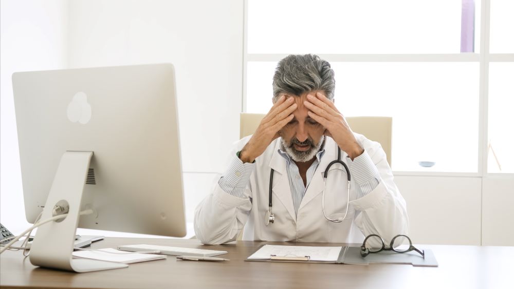 Stressed male doctor