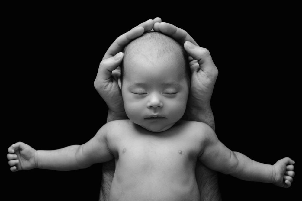 Newborn baby sleeping soundly with gentle breathing