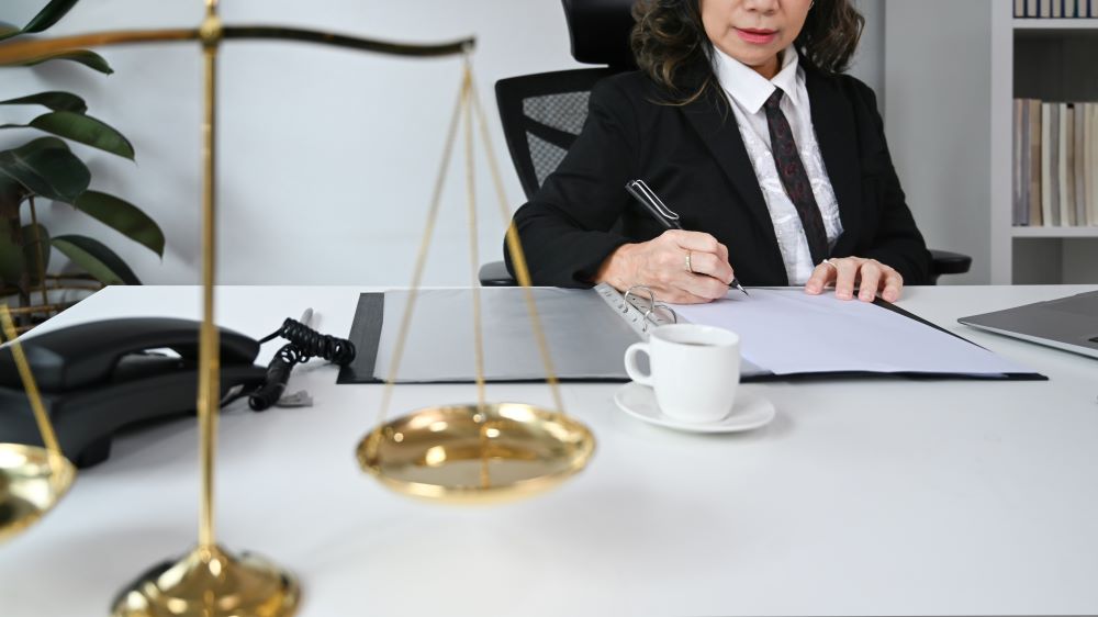 legal advisor holding a judge's hammer in the formal office